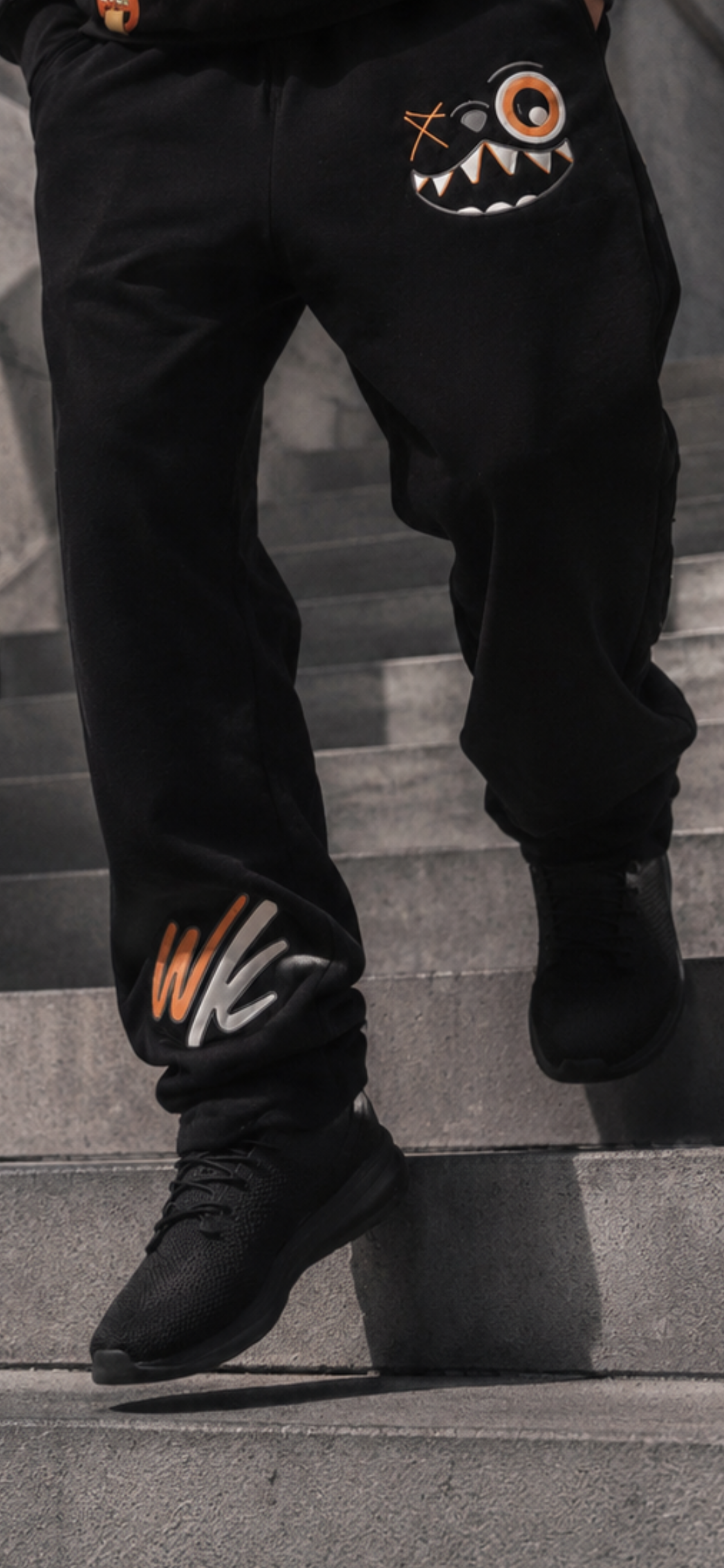 ORANGE AND BLACK PANTS